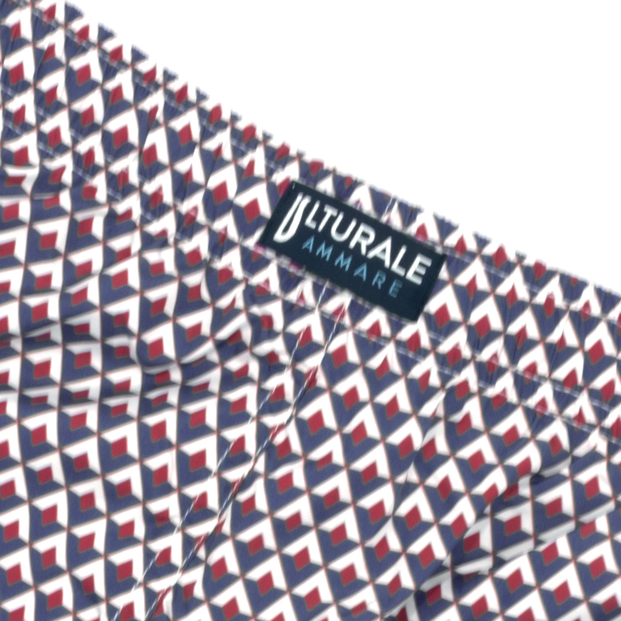 Costume con pattern rombi blu, bianco e rosso