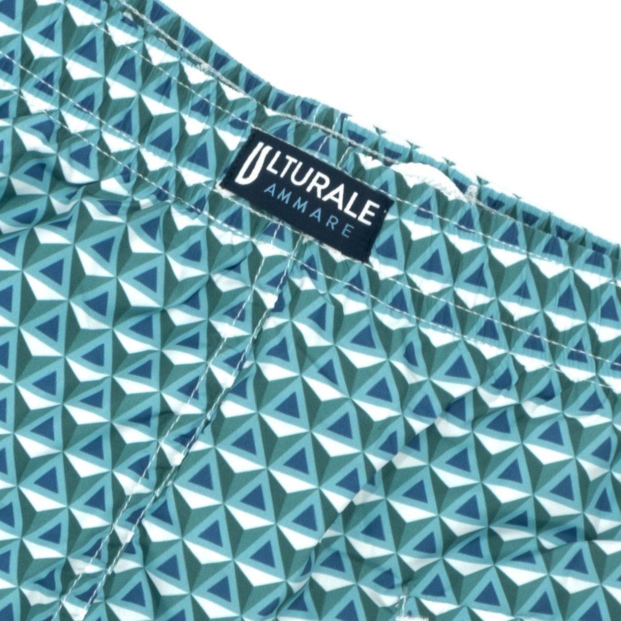 Costume con pattern prisma verde, azzurro e blu