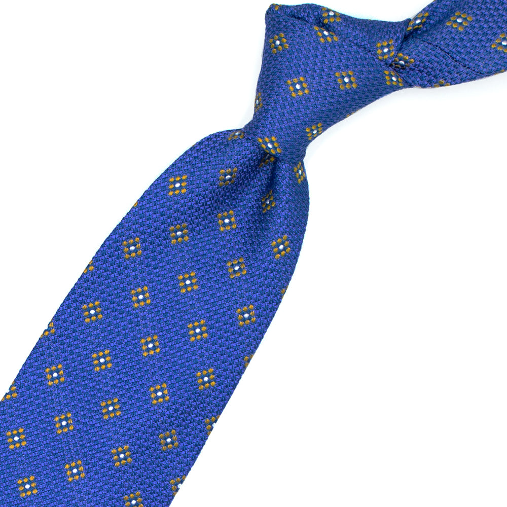 Cravatta azzurra con pattern geometrico giallo e bianco