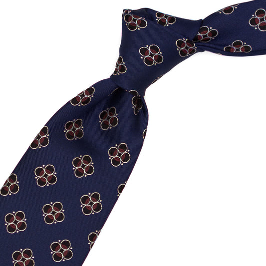 Cravatta blu con pattern nero, bianco e bordeaux