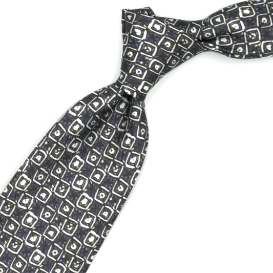 Cravatta marrone con pattern astratto bianco e blu