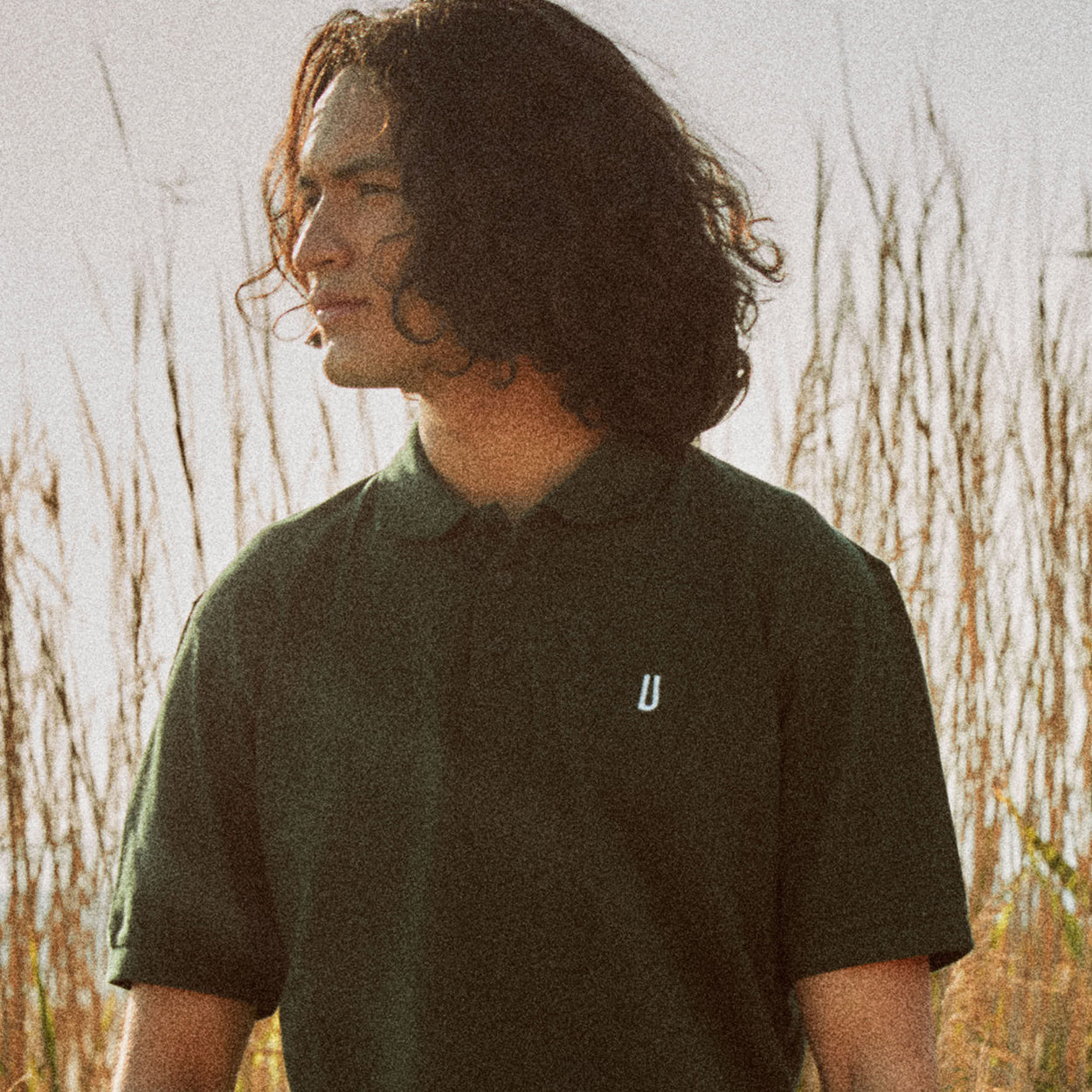 Polo verde con logo Ulturale bianco