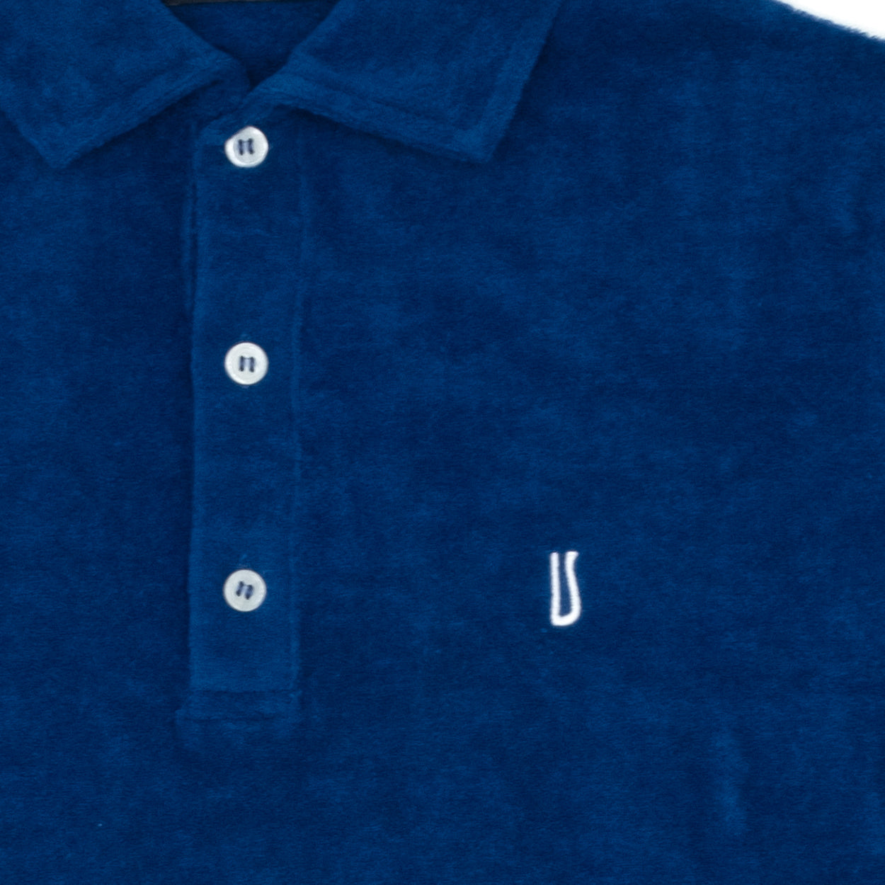 Polo in spugna blu con logo Ulturale bianco