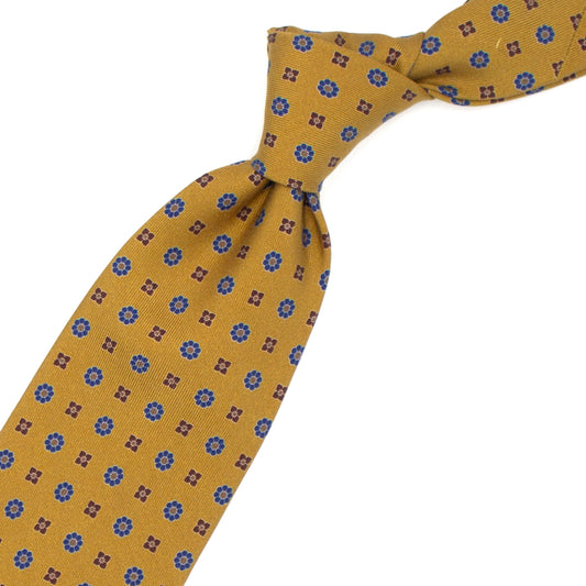 Cravatta senape con fiorellini blu e marroni