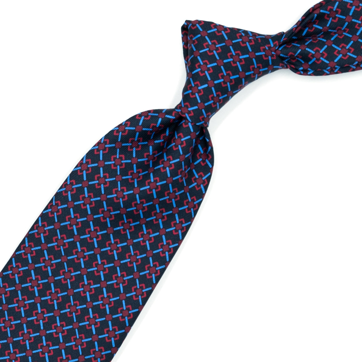 Cravatta blu con pattern geometrico azzurro e rosso