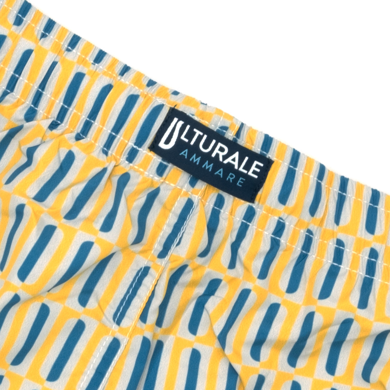 Costume con pattern geometrico verticale giallo e blu