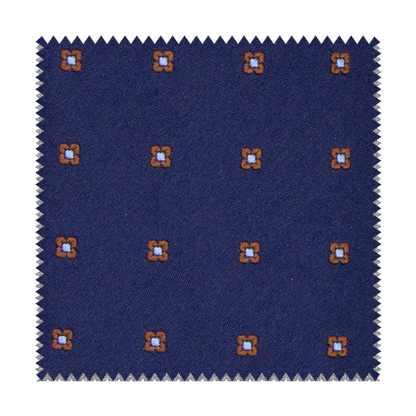 Tessuto blu con fiori marroni e azzurri