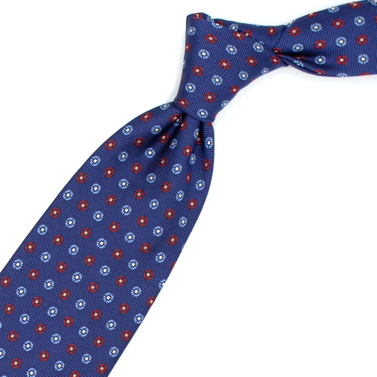 Cravatta blu con fiori azzurri e rossi e quadratini bianchi
