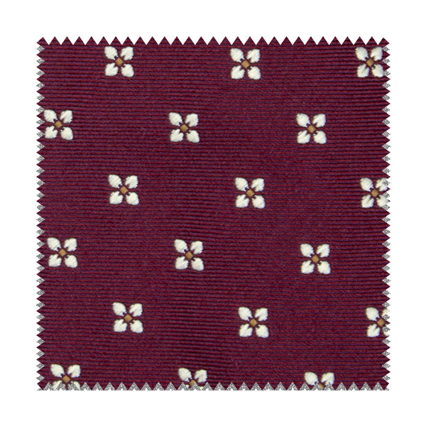 Tessuto bordeaux con fiori bianchi e quadratini gialli