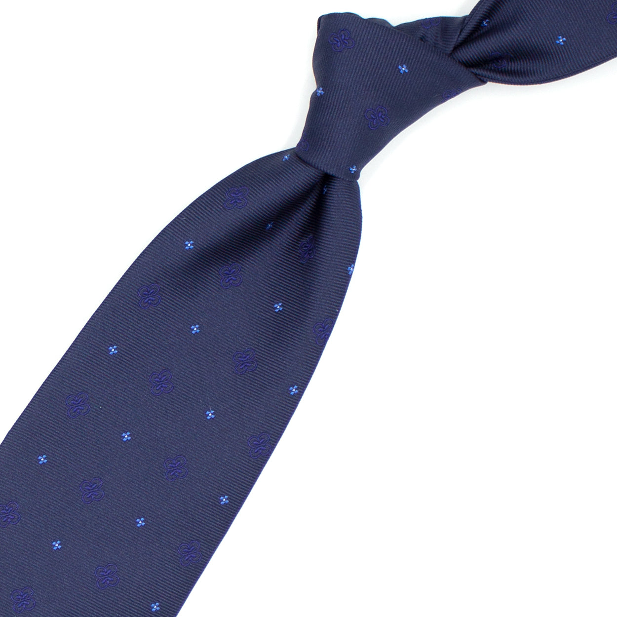 Cravatta blu con fiorellini azzurri e blu tono su tono