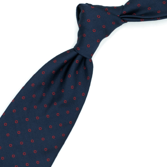 Cravatta blu con cerchietti rossi