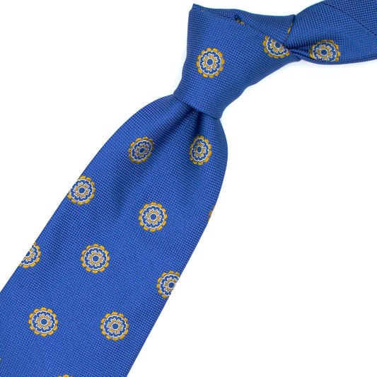 Cravatta azzurra con medaglioni gialli