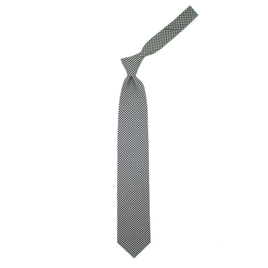 Green tie with white polka dots