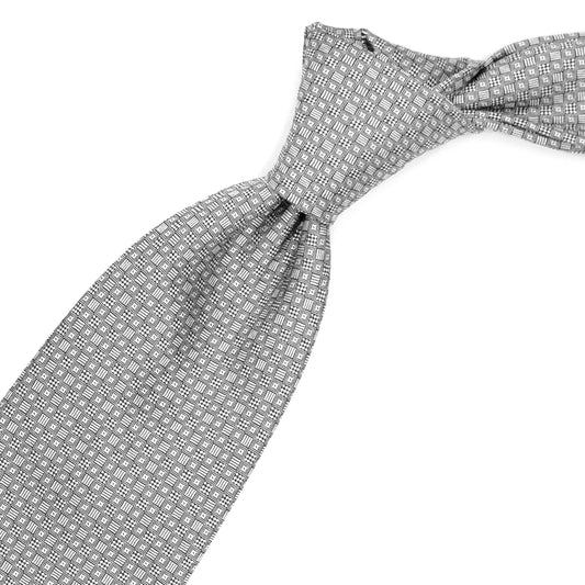 Cravatta grigia con quadratini bianchi e neri