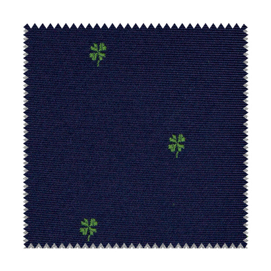 Tessuto blu con quadrifogli verdi