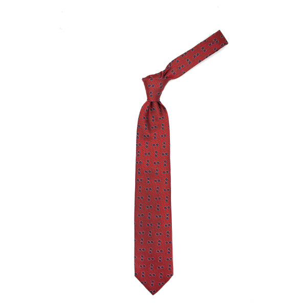 Cravatta rossa con cerchi blu e puntini bianchi