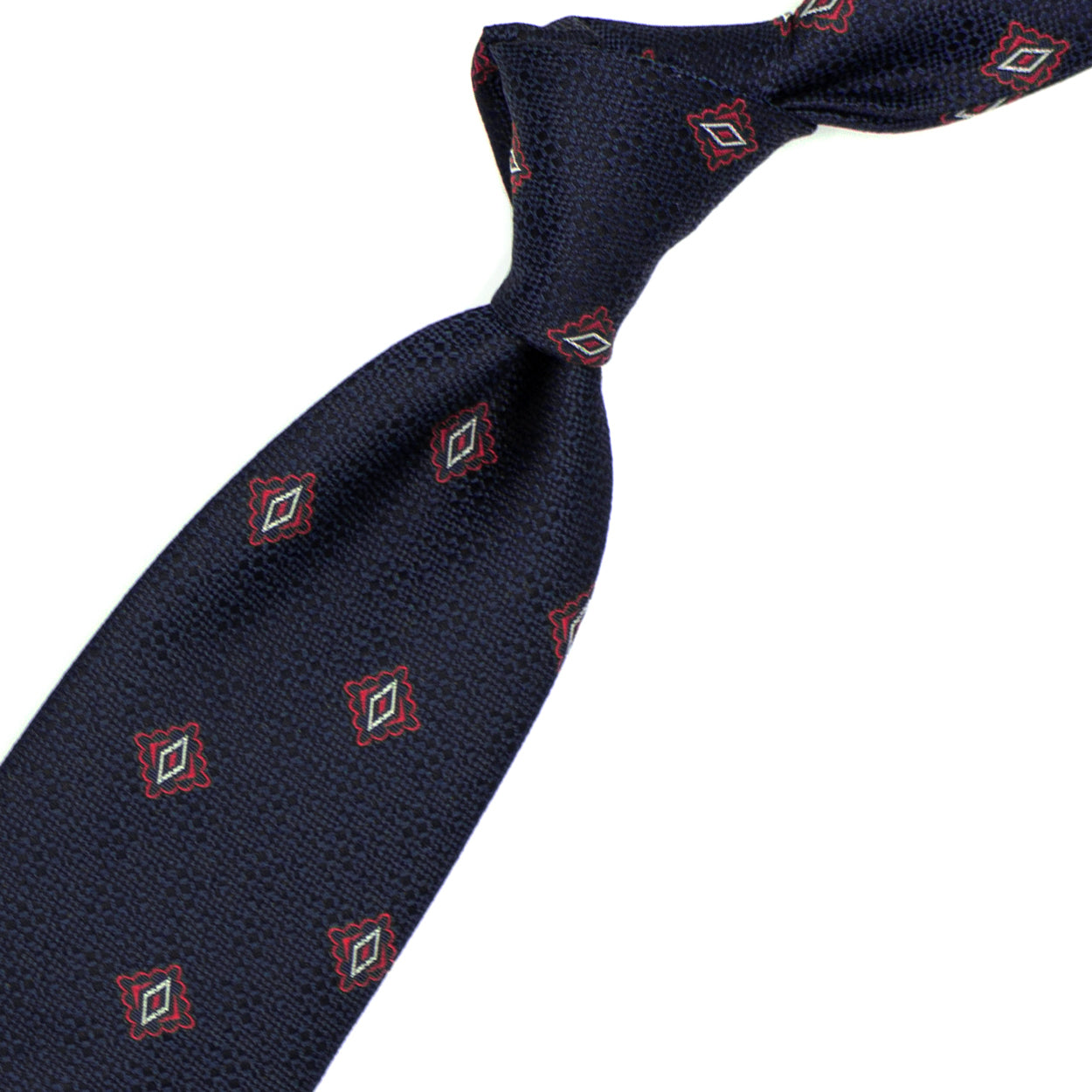 Cravatta blu con pattern geometrico rosso e bianco