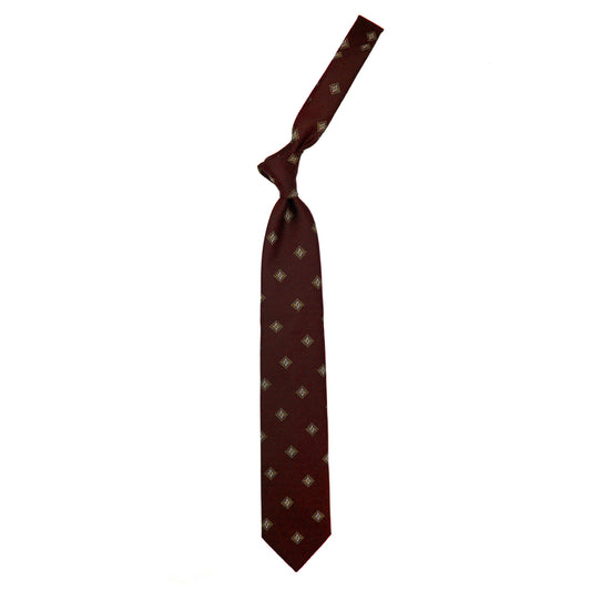 Cravatta bordeaux con pattern geometrico dorato e bianco