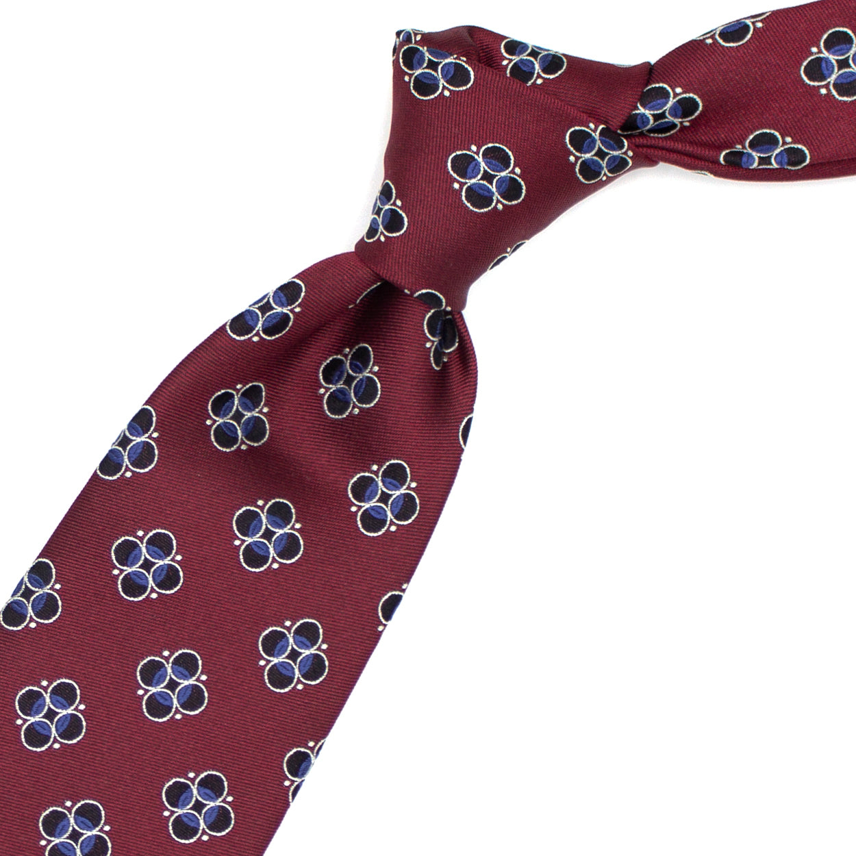 Cravatta rossa con pattern geometrico blu, azzurro e grigio