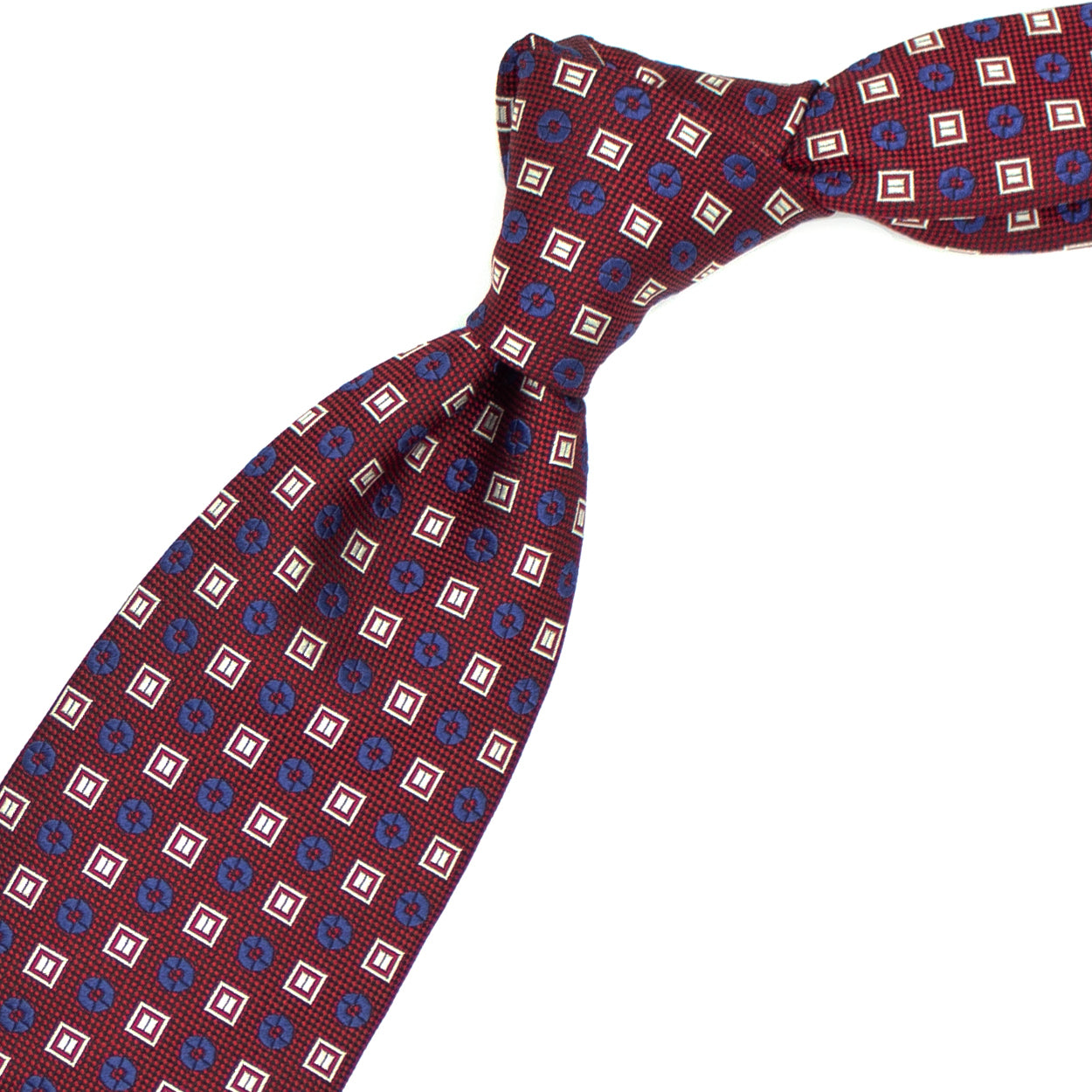 Cravatta bordeaux con fiorellini blu e quadratini bianchi