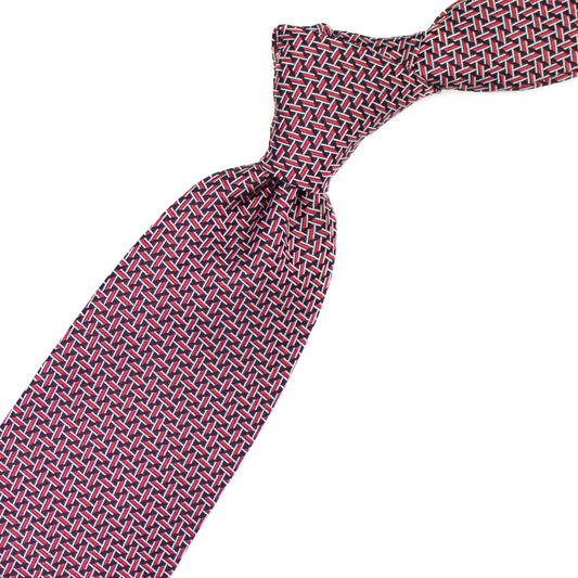 Cravatta con pattern geometrico rosso, bianco e nero