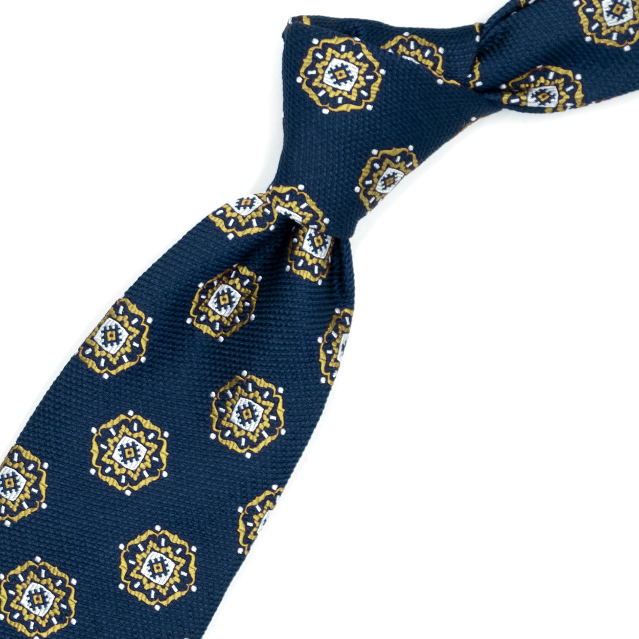 Cravatta blu con medaglioni gialli e bianchi