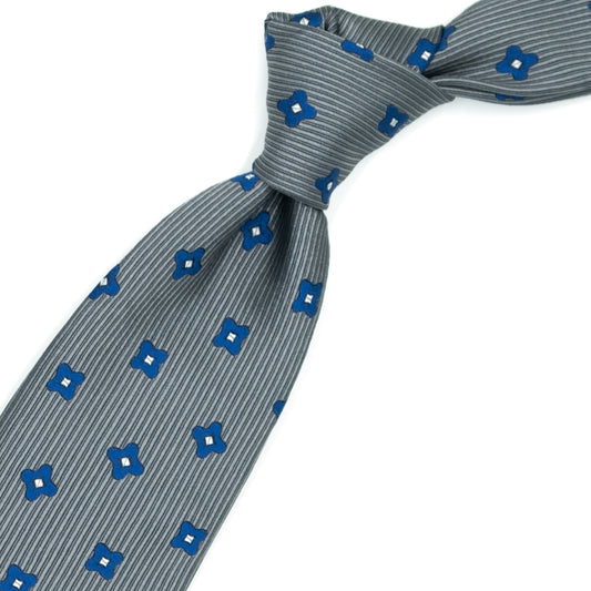 Cravatta grigia con fiori bluette e quadratini grigi