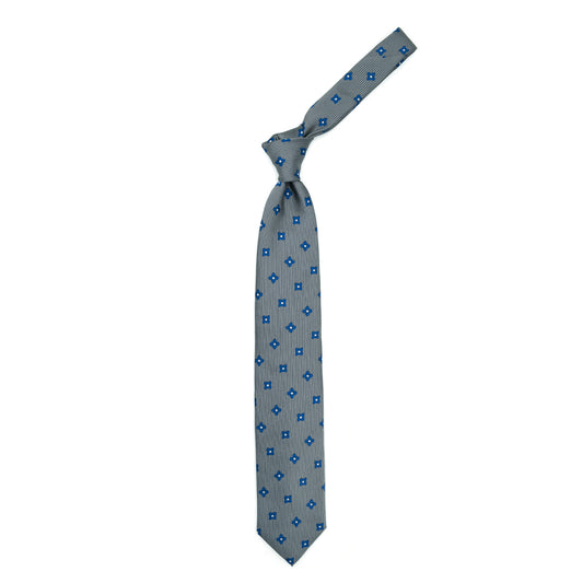 Cravatta grigia con fiori bluette e quadratini grigi