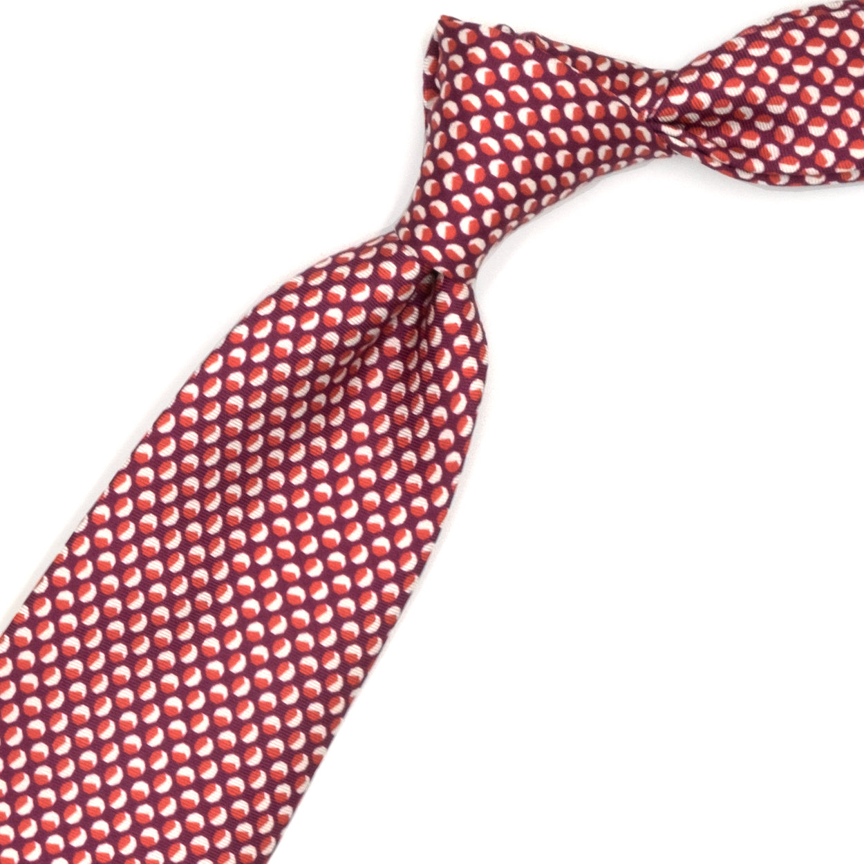 Cravatta magenta con pattern geometrico bianco e rosso