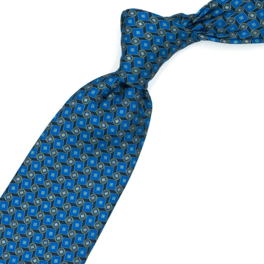 Cravatta blu con cerchi e quadrati azzurri