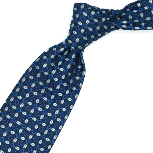 Cravatta blu con ovali grigi e fiorellini azzurri